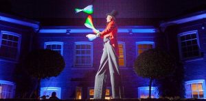 circus themed stilt walking juggler
